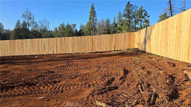 view of yard with a fenced backyard