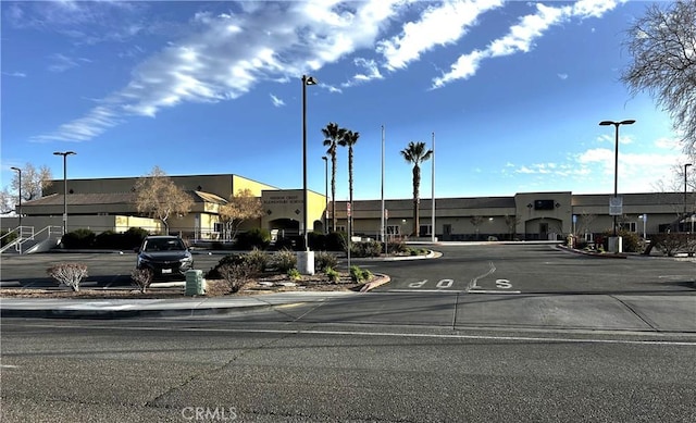 view of property featuring uncovered parking