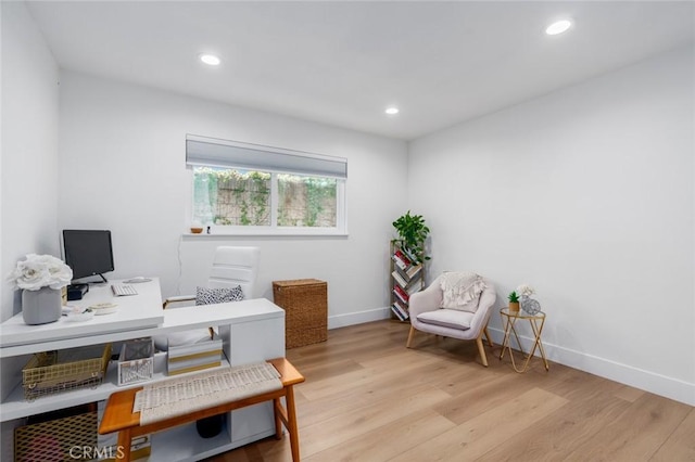 home office featuring baseboards, recessed lighting, and light wood-style floors