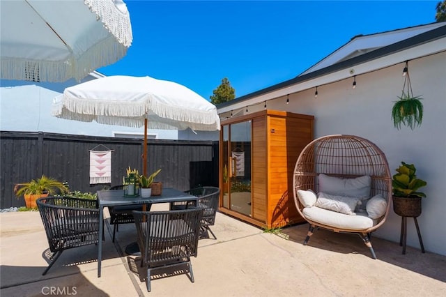 view of patio / terrace with fence and outdoor dining space