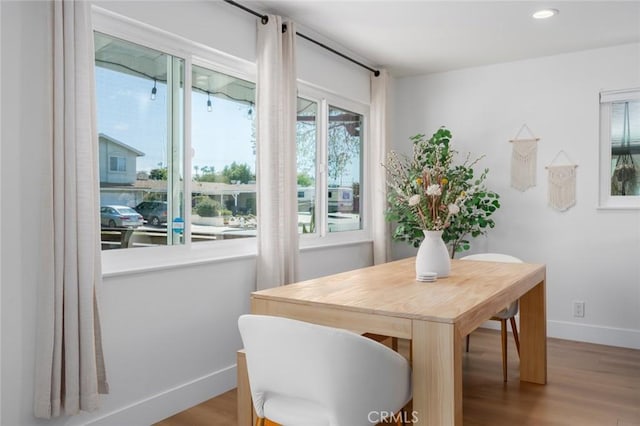 dining area with wood finished floors, recessed lighting, and baseboards