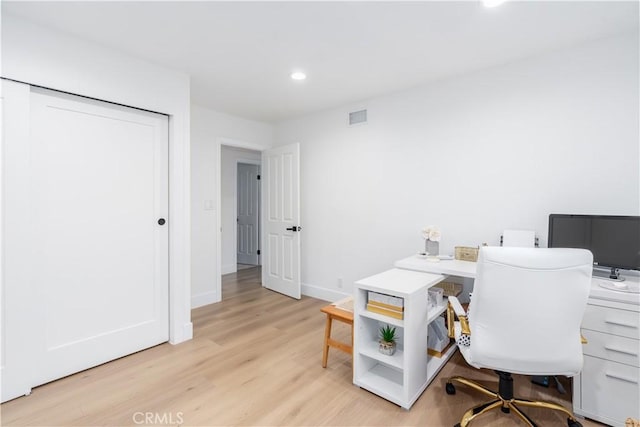 home office featuring baseboards, visible vents, recessed lighting, and light wood-style floors
