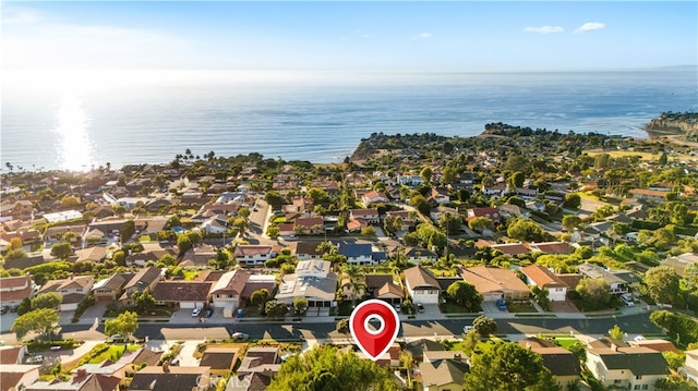 drone / aerial view with a residential view and a water view