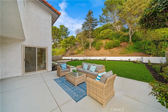 view of patio / terrace featuring outdoor lounge area and fence