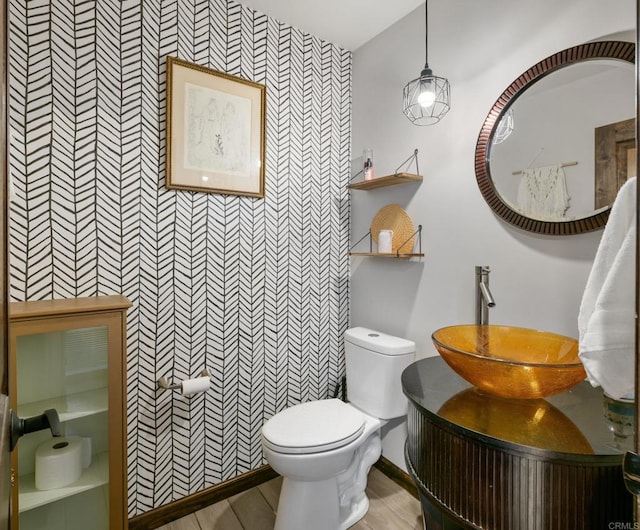 bathroom featuring toilet and vanity