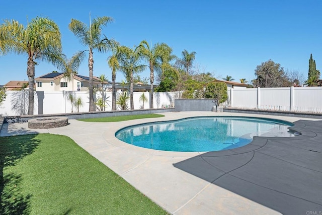 view of swimming pool with a yard, a patio area, a fenced backyard, and a fenced in pool