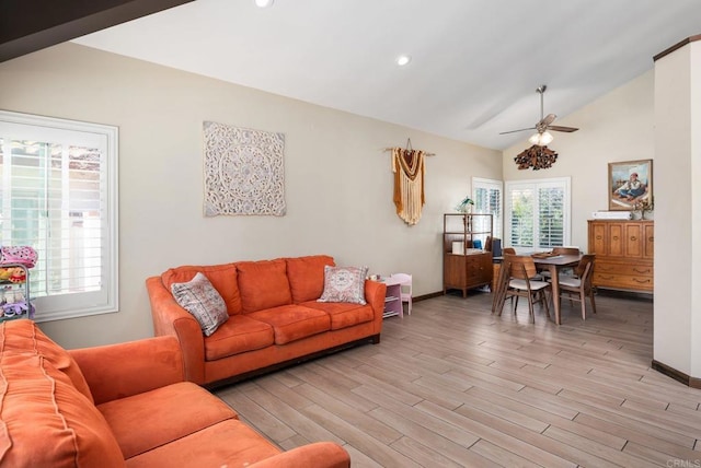 living area featuring vaulted ceiling, recessed lighting, baseboards, and light wood-style floors