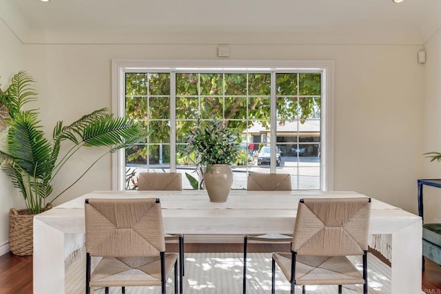 dining area with plenty of natural light and wood finished floors