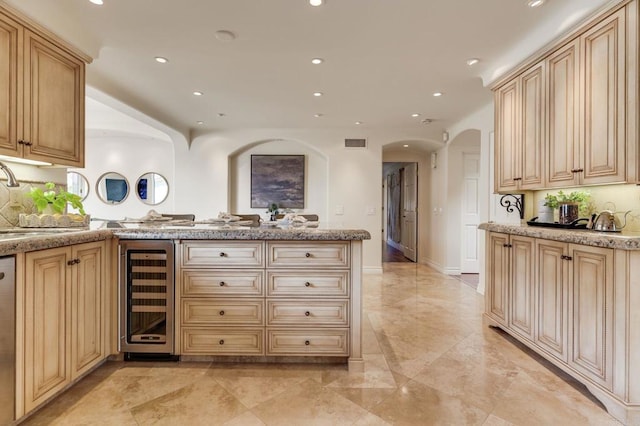 bar featuring beverage cooler, visible vents, marble finish floor, a sink, and recessed lighting