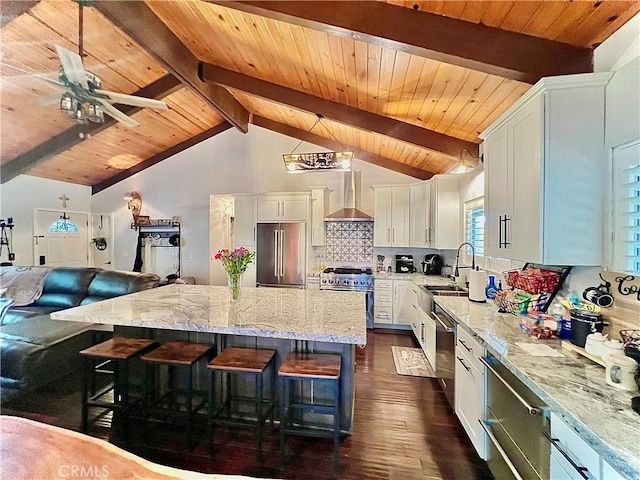 370 Weisshorn Dr, Crestline, CA 92325 - kitchen with dark wood finished floors, wooden ceiling, high end appliances, wall chimney range hood, and a sink
