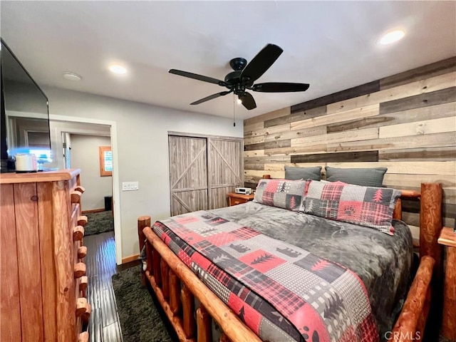 370 Weisshorn Dr, Crestline, CA 92325 - bedroom featuring wood finished floors, wooden walls, recessed lighting, and baseboards