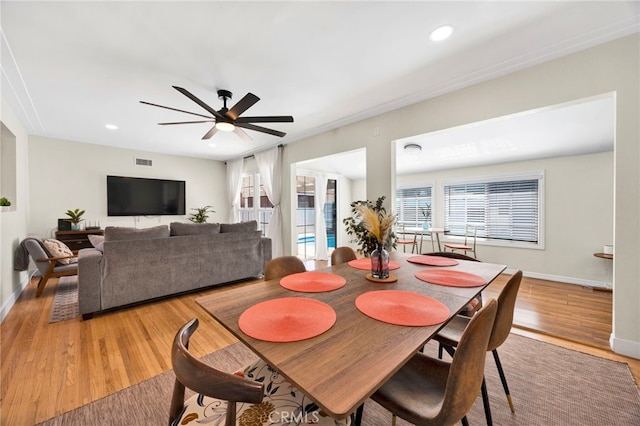 dining space with recessed lighting, visible vents, light wood-style floors, a ceiling fan, and baseboards