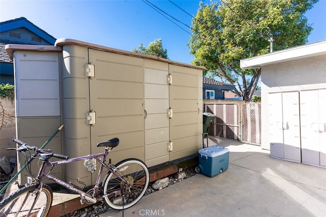 view of shed with fence