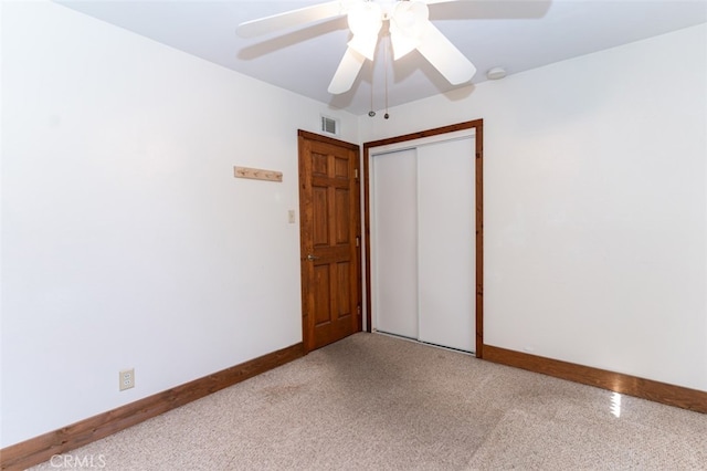 unfurnished room featuring visible vents, baseboards, and a ceiling fan