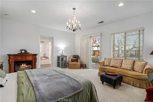 bedroom with access to exterior, carpet flooring, visible vents, and multiple windows