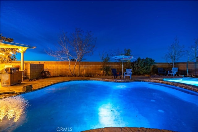 view of pool with a fenced backyard and a fenced in pool