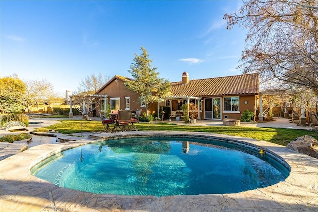 pool with a yard and a pergola