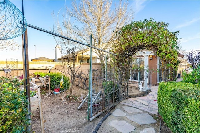 view of yard featuring a garden and fence