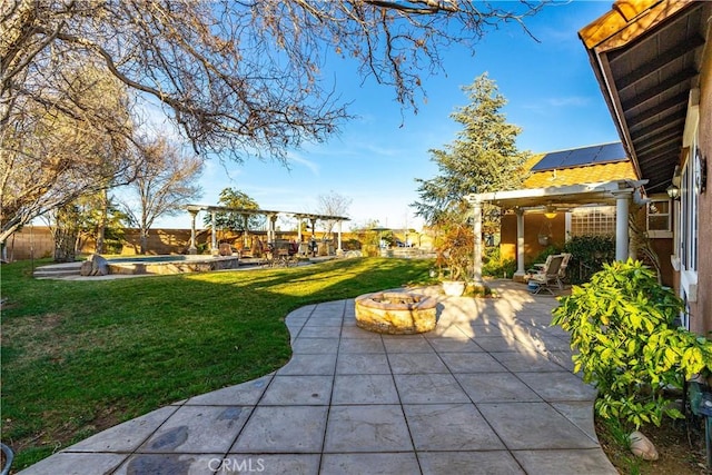 view of yard with a fenced in pool, an outdoor fire pit, a patio, and a pergola