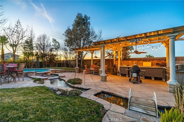 view of patio / terrace with an in ground hot tub, a fenced backyard, a fenced in pool, and a pergola