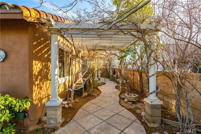 view of patio with central AC unit, a fenced backyard, and a pergola