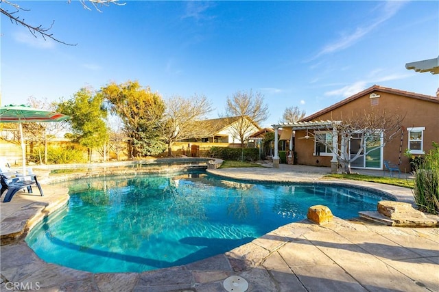 view of pool with a patio area, a fenced in pool, and a pergola