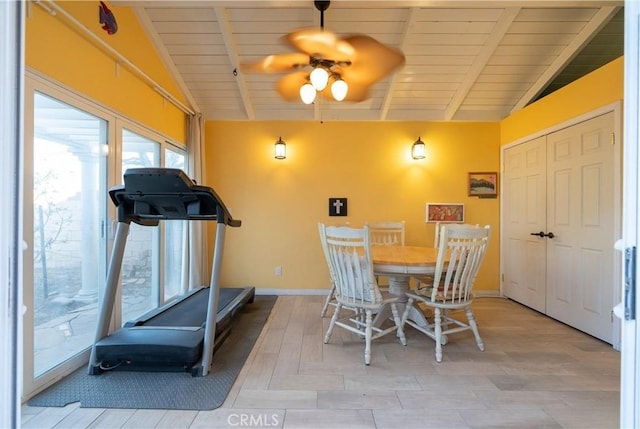 dining space featuring lofted ceiling with beams, wooden ceiling, a ceiling fan, and baseboards