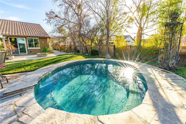 view of pool with a fenced backyard, a fenced in pool, and a patio