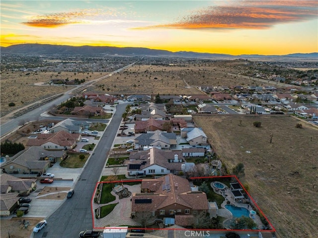 birds eye view of property with a residential view and a mountain view