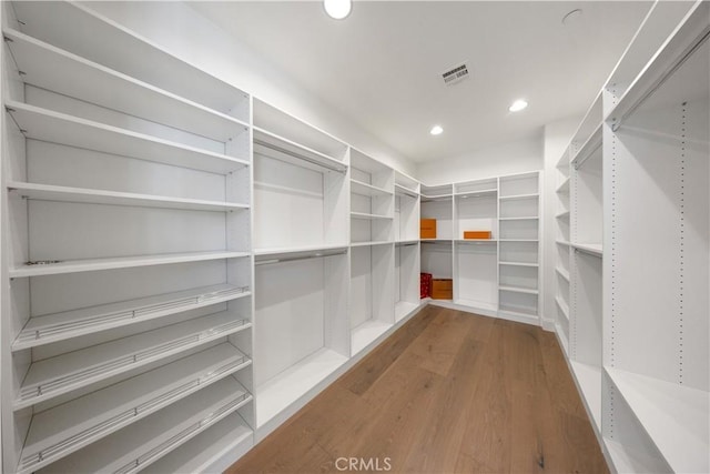 interior space featuring visible vents and wood finished floors