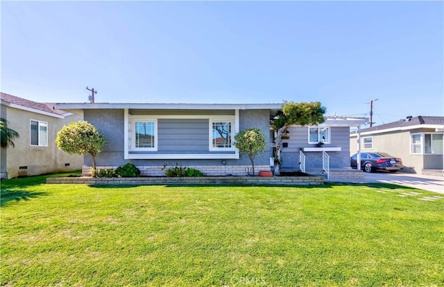 view of front of property with a front lawn and stucco siding