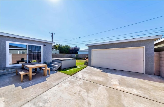 detached garage featuring fence