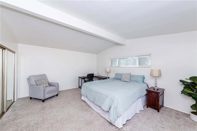 bedroom with lofted ceiling with beams and light colored carpet