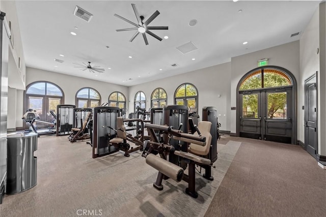 workout area featuring ceiling fan, light colored carpet, recessed lighting, visible vents, and french doors