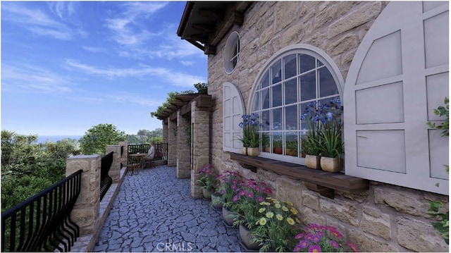 view of side of home featuring a patio area