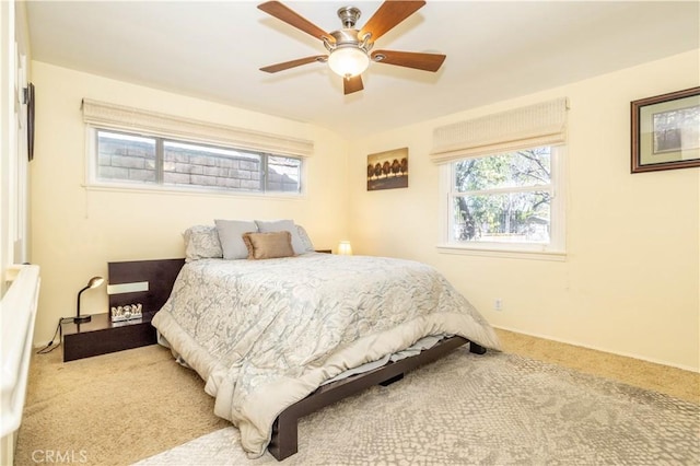 carpeted bedroom with a ceiling fan