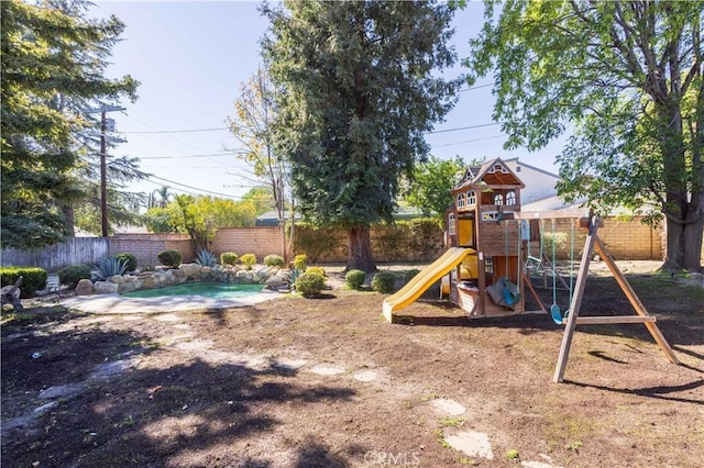 view of jungle gym with a fenced backyard