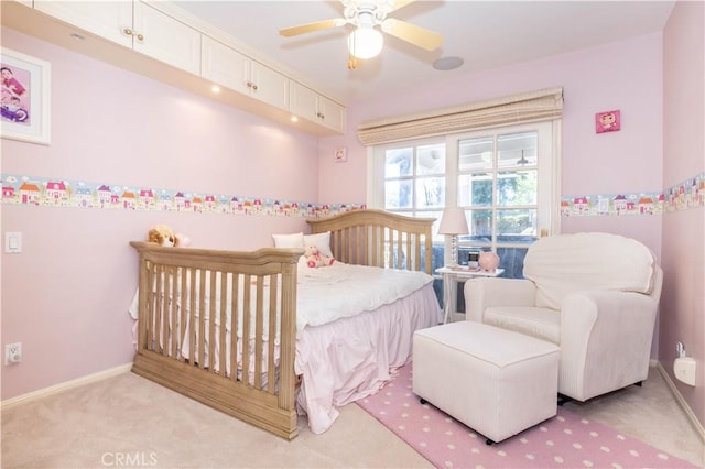 bedroom with light carpet and baseboards