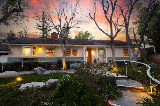 view of front of house with a chimney