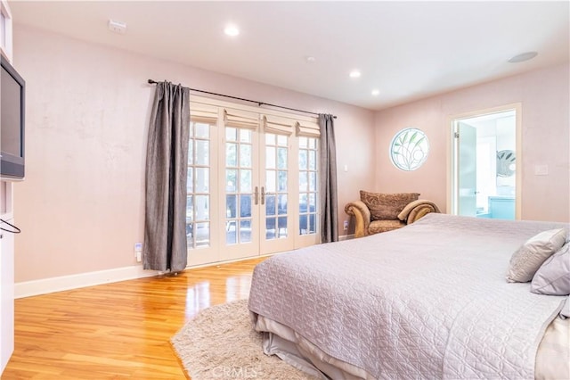 bedroom featuring baseboards, light wood finished floors, connected bathroom, and recessed lighting