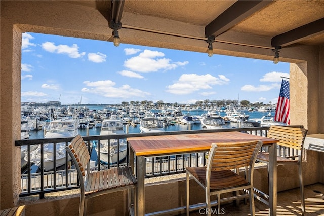 balcony featuring a water view