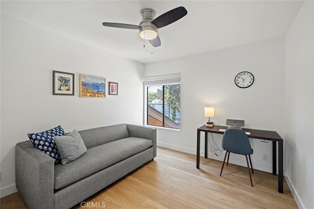 office area with light wood-type flooring and baseboards