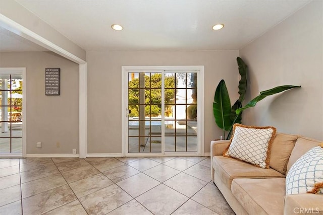 entryway featuring a wealth of natural light, light tile patterned flooring, and recessed lighting