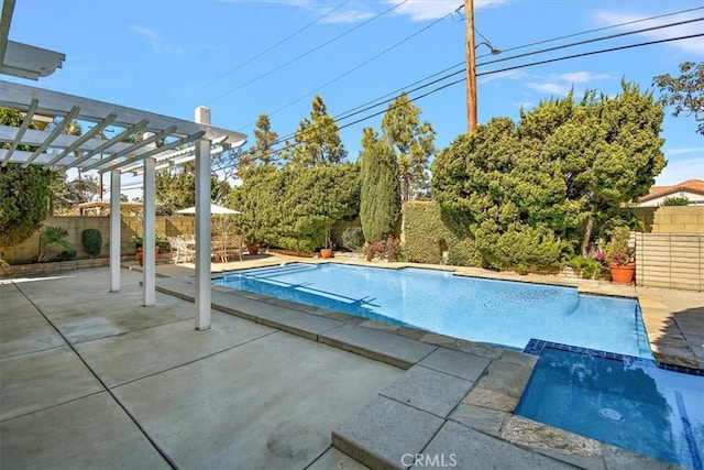 view of swimming pool featuring a patio, a fenced backyard, a pool with connected hot tub, and a pergola