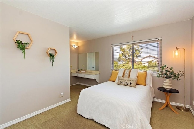 bedroom with carpet flooring and baseboards