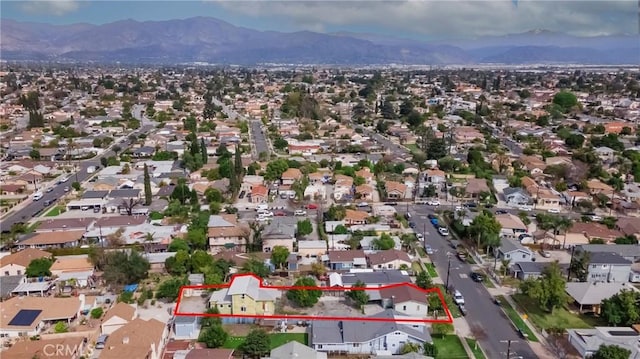 birds eye view of property featuring a mountain view and a residential view