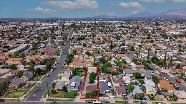 drone / aerial view with a mountain view and a residential view