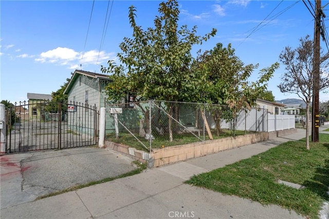 view of front of home featuring a gate and fence