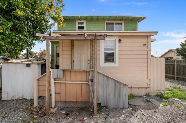 exterior space with an outdoor structure and fence