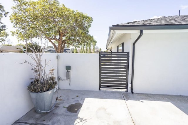 view of gate with fence